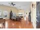 Spacious living room featuring hardwood floors, vaulted ceilings, and abundant natural light from large windows at 10-1 Rattan Circle # 1, Pawleys Island, SC 29585