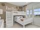 bedroom featuring a cozy bunk bed, neutral color scheme, and natural light from the window at 1030 Laconic Dr., Myrtle Beach, SC 29588