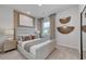 Main bedroom featuring a large, comfortable bed, neutral tones, and natural lighting at 1030 Laconic Dr., Myrtle Beach, SC 29588