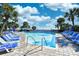 Exterior shot of the pool and surrounding lounge chairs and palm trees at 1105 S Ocean Blvd. # 336, Myrtle Beach, SC 29577