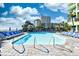 Exterior view of the pool and surrounding lounge chairs and palm trees at 1105 S Ocean Blvd. # 336, Myrtle Beach, SC 29577