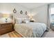 Serene main bedroom featuring a plush bed, decorative mirrors, and coordinating nightstands at 1152 Blueback Herring Way # 144, Conway, SC 29526