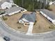 An aerial view of a single-Gathering home showcasing its layout, landscaping, and proximity to neighboring residences at 1222 Midtown Village Dr., Conway, SC 29526