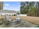 Relaxing backyard featuring a patio with seating and a tree-lined perimeter at 1222 Midtown Village Dr., Conway, SC 29526