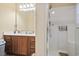 Bathroom features a shower stall with glass door and vanity with dark wood cabinetry at 1222 Midtown Village Dr., Conway, SC 29526