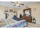 Comfortable bedroom featuring a ceiling fan and a large dresser with plenty of storage at 1222 Midtown Village Dr., Conway, SC 29526