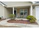 Inviting front porch features rocking chairs, landscaping, and an appealing entrance at 1222 Midtown Village Dr., Conway, SC 29526