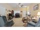 Comfortable living room with a ceiling fan, piano, and front door view at 1222 Midtown Village Dr., Conway, SC 29526