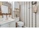 Bathroom featuring a gold framed mirror, vanity, and toilet at 131 Greenside Villas Dr. # B10, Little River, SC 29566