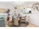 Charming dining area with chandelier and modern decor next to the kitchen at 131 Greenside Villas Dr. # B10, Little River, SC 29566