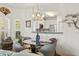 Bright dining area with chandelier and views into the adjacent kitchen at 131 Greenside Villas Dr. # B10, Little River, SC 29566