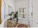 Inviting entryway featuring unique chest, mirror, and window with natural light at 131 Greenside Villas Dr. # B10, Little River, SC 29566