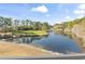 Golf course and lake view showing the beautiful greenery and landscape that surrounds this home at 131 Greenside Villas Dr. # B10, Little River, SC 29566