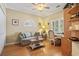 Cozy living room featuring natural light, couch, and built-in shelving at 131 Greenside Villas Dr. # B10, Little River, SC 29566