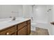 Bathroom featuring a single sink vanity, wood cabinets, white countertops, and chrome fixtures at 145 Goldenrod Circle # 7B, Little River, SC 29566