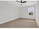 A bedroom featuring neutral walls, carpet flooring, a ceiling fan, and a window at 145 Goldenrod Circle # 7B, Little River, SC 29566