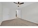 Bedroom featuring neutral walls, carpet flooring, a ceiling fan, and two closets at 145 Goldenrod Circle # 7B, Little River, SC 29566