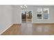 Dining area with modern lighting and sliding glass doors to the backyard at 145 Goldenrod Circle # 7B, Little River, SC 29566