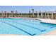 Community swimming pool with blue tile lines, stainless steel ladders, and nearby seating at 1800 Tryon Dr, Myrtle Beach, SC 29588