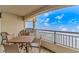 Relaxing balcony with table and chairs offering beautiful sky views at 1819 Ocean Blvd. N # 1403, North Myrtle Beach, SC 29582