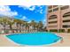 Large outdoor pool with lounge chairs and lush landscaping at 1819 Ocean Blvd. N # 1403, North Myrtle Beach, SC 29582