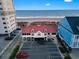 Beachside property features a red roof, ample parking, and convenient access to the ocean at 1822 Topsail Ln., North Myrtle Beach, SC 29582