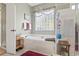 Bright bathroom featuring a soaking tub with marble surround and a glass-enclosed shower for a spa-like experience at 1822 Topsail Ln., North Myrtle Beach, SC 29582