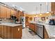 Spacious kitchen with stainless steel appliances, granite countertops, and natural wood cabinetry at 1822 Topsail Ln., North Myrtle Beach, SC 29582