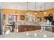 Bright kitchen with granite counters and stainless steel appliances, with an adjacent breakfast room and a view to the sunroom at 1822 Topsail Ln., North Myrtle Beach, SC 29582