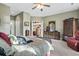 Inviting main bedroom showcasing a dresser, soft carpet, and a glimpse into an adjacent kitchen at 1822 Topsail Ln., North Myrtle Beach, SC 29582