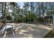 Outdoor basketball court area with picnic benches, providing space for recreational activities and gatherings at 2120 Adams Way, Little River, SC 29566