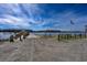 Scenic boat ramp with a clear blue sky and USA flag, offering waterfront access and serene views at 2120 Adams Way, Little River, SC 29566