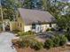 Charming yellow cottage featuring a well-maintained yard and inviting curb appeal at 2120 Adams Way, Little River, SC 29566