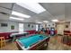 Vibrant game room featuring a pool table, foosball, and arcade games, perfect for entertainment and recreation at 2120 Adams Way, Little River, SC 29566