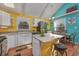 Bright and airy kitchen featuring white cabinetry, modern appliances, and an island with seating at 2120 Adams Way, Little River, SC 29566