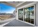 Serene balcony view with sliding glass door providing seamless indoor-outdoor living at 223 Gloucester Way, Little River, SC 29566