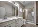 Bathroom with double sink vanity and glass enclosed shower at 223 Gloucester Way, Little River, SC 29566