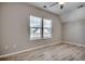 Bedroom with a ceiling fan, window and light wood flooring at 223 Gloucester Way, Little River, SC 29566