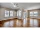 Bright, open living room featuring hardwood floors, lots of natural light, and a ceiling fan at 223 Gloucester Way, Little River, SC 29566