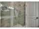 Elegant glass shower with marble-style tile and modern shower fixtures at 223 Gloucester Way, Little River, SC 29566