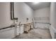 Well-lit utility room with shelving and space for laundry appliances at 223 Gloucester Way, Little River, SC 29566