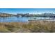 Picturesque waterway view featuring docked boats, a drawbridge, and buildings in the background at 223 Gloucester Way, Little River, SC 29566