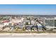 Aerial view of beachfront homes with pools, landscaping, and beach access at 2402 N Ocean Blvd., North Myrtle Beach, SC 29582