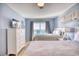 Bright bedroom featuring two beds, ocean view, and neutral decor at 2402 N Ocean Blvd., North Myrtle Beach, SC 29582