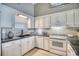 Efficient kitchen featuring white cabinets and sleek countertops at 2402 N Ocean Blvd., North Myrtle Beach, SC 29582