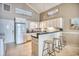 Bright kitchen featuring white cabinets, modern appliances, and bar stool seating at 2402 N Ocean Blvd., North Myrtle Beach, SC 29582