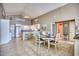 Inviting dining area with a view of the kitchen, breakfast bar, and coastal-themed decor at 2402 N Ocean Blvd., North Myrtle Beach, SC 29582