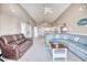 Spacious living room with vaulted ceilings and beachy decor provides a relaxing atmosphere at 2402 N Ocean Blvd., North Myrtle Beach, SC 29582