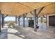 Open-air space underneath a raised home with picnic table and a hot tub at 2402 N Ocean Blvd., North Myrtle Beach, SC 29582