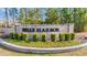 The beautiful Belle Harbor community sign is surrounded by manicured landscaping and greenery at 2475 Blue Crane Circle # 103, Myrtle Beach, SC 29577